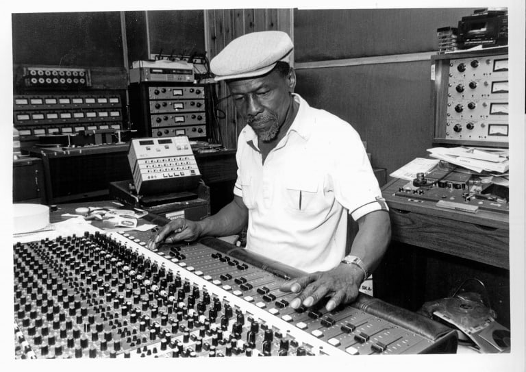 Man at large studio mixer